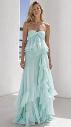 Front view of model wearing mint green strapless ruffled maxi dress