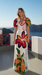 Model wearing white floral puff sleeve maxi dress from the front