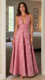 Front view of model wearing the pink floral jacquard halter maxi dress