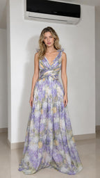 Front view of model wearing lavender floral ruffle strap maxi dress