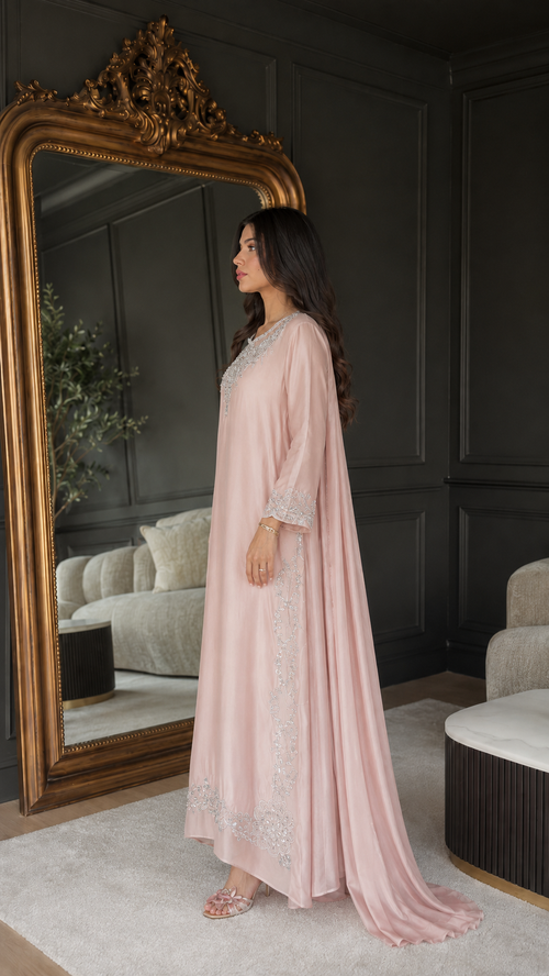 Side view of blush pink embroidered maxi kaftan dress with matching draped layer