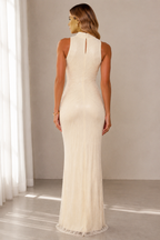 Back view of ivory sleeveless textured maxi gown with keyhole detail