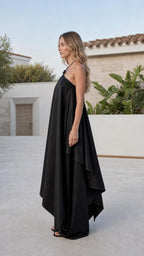 Side profile view of black wide leg jumpsuit