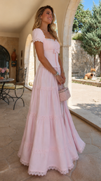 Side view of blush pink square neck tiered maxi dress with front bow