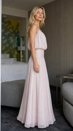 Side view of pink maxi dress showcasing draped bodice