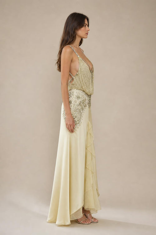 Side profile view of champagne evening gown