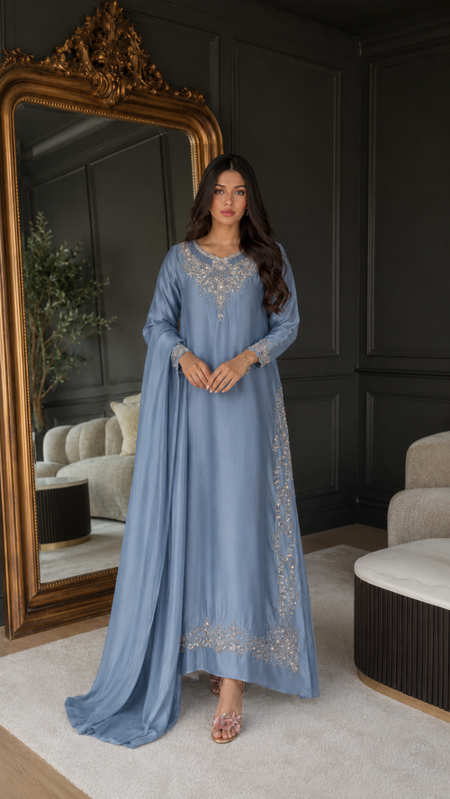 Front view of dusty blue embroidered maxi kaftan dress with long sleeves and flowing silhouette