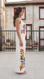 Side profile view of white floral embroidered pant set