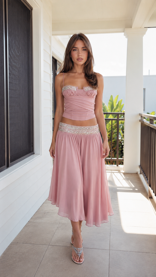 Front view of blush pink ruched bustier cami top and midi skirt set