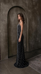 Side profile view of black beaded evening dress