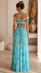 Back view of aqua two-piece set with strappy open back and full-length flowing skirt