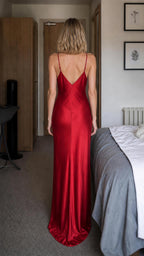 Red satin-look slip dress shown from the back with a low V-back and slim straps