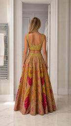 Back view of woman showcasing the embroidered blouse back and flared skirt