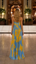 Back view of blue floral pleated maxi dress