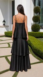 Back view of model in black tiered maxi dress