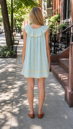 Back view of light blue ruffled mini dress