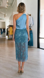 Model wearing blue set back view