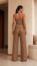 Back view of champagne sequin halter top and wide leg pants set