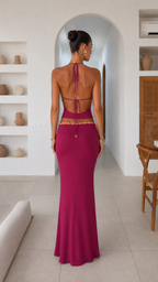 Back view of fuchsia open-back halter top and maxi skirt set