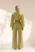 Back view of model wearing olive textured matching set