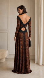 Back view of brown maxi evening dress with open back and crossover strap detail