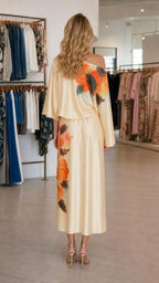 Back view of champagne midi dress showcasing drape
