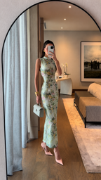 Angled front view of mint floral high neck fitted dress