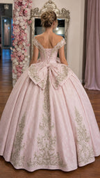 Back view of pink ballgown showing lace-up corset and bow