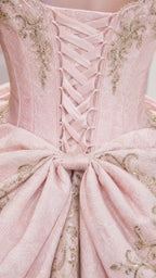 Close-up detail of lace-up corset back and embroidered bow