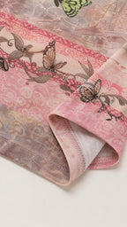 Close-up detail of the pink butterfly print fabric and hem