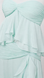 Close-up detail of bodice and ruffles on mint green dress