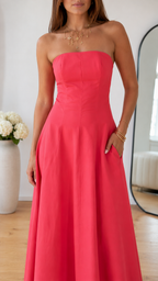 Close-up of coral pink strapless bodice and waist seam detailing