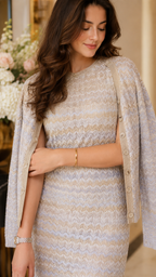 Close-up of oatmeal textured knit fabric, round neckline, and matching button-front cardigan