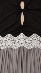 Close-up of bodice cutout and white lace waist trim