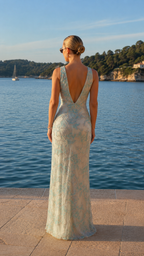Back view of mint embellished lace maxi evening dress with low V back