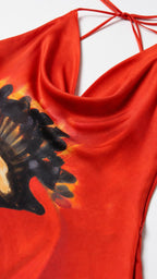 Close up of red cowl neckline and fabric texture