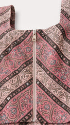 Close-up of zip front detail on paisley top