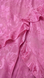 Close-up detail of tonal floral jacquard texture and ruffles
