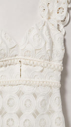 Close-up detail of white lace bodice and cutout pattern