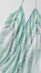 Close-up of embellished neckline and paisley print