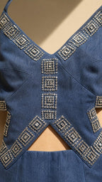 Close-up of rhinestone embellishments and waist cutouts