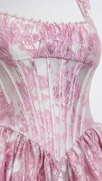 Close-up detail of the pearl trimmed neckline and corset bodice