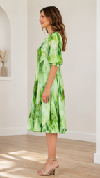 Side view of lime green tie-dye midi dress showing A-line silhouette