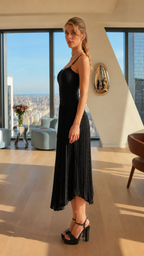 Side view of black shimmer pleated midi dress