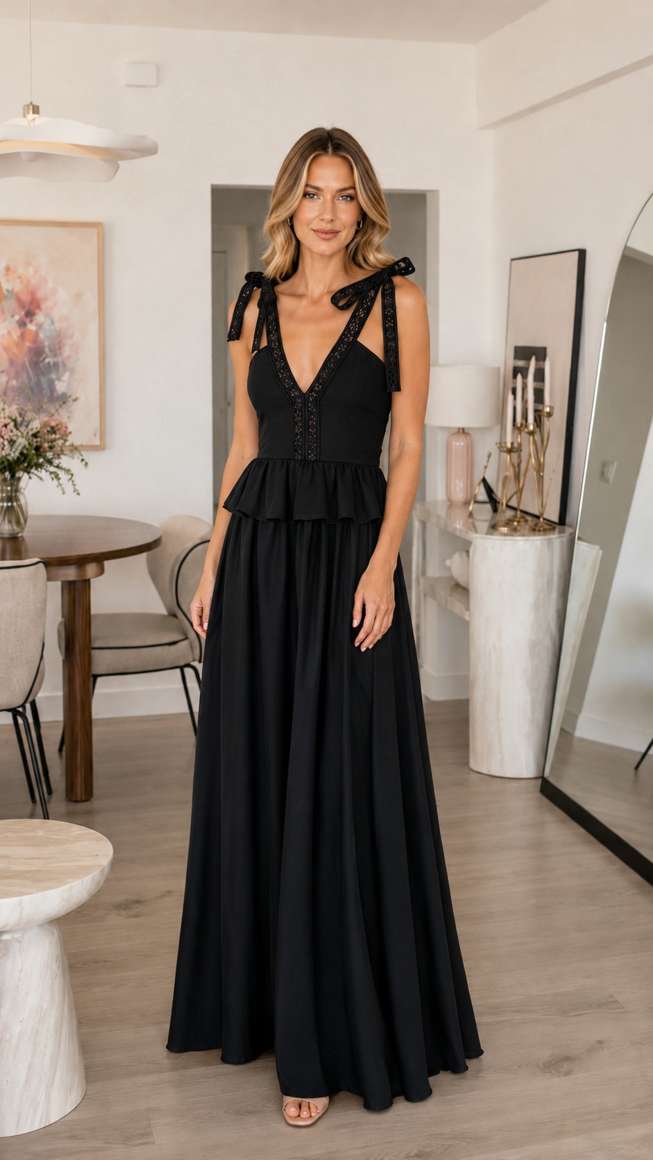 Front view of solid black tie shoulder maxi dress with deep V neckline and tiered waist