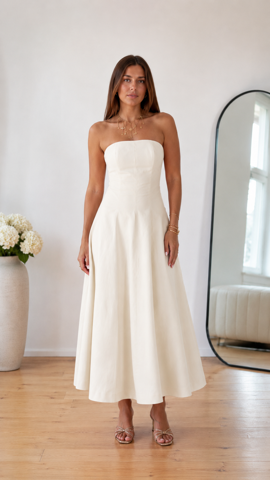 Front view of ivory strapless A-line midi dress