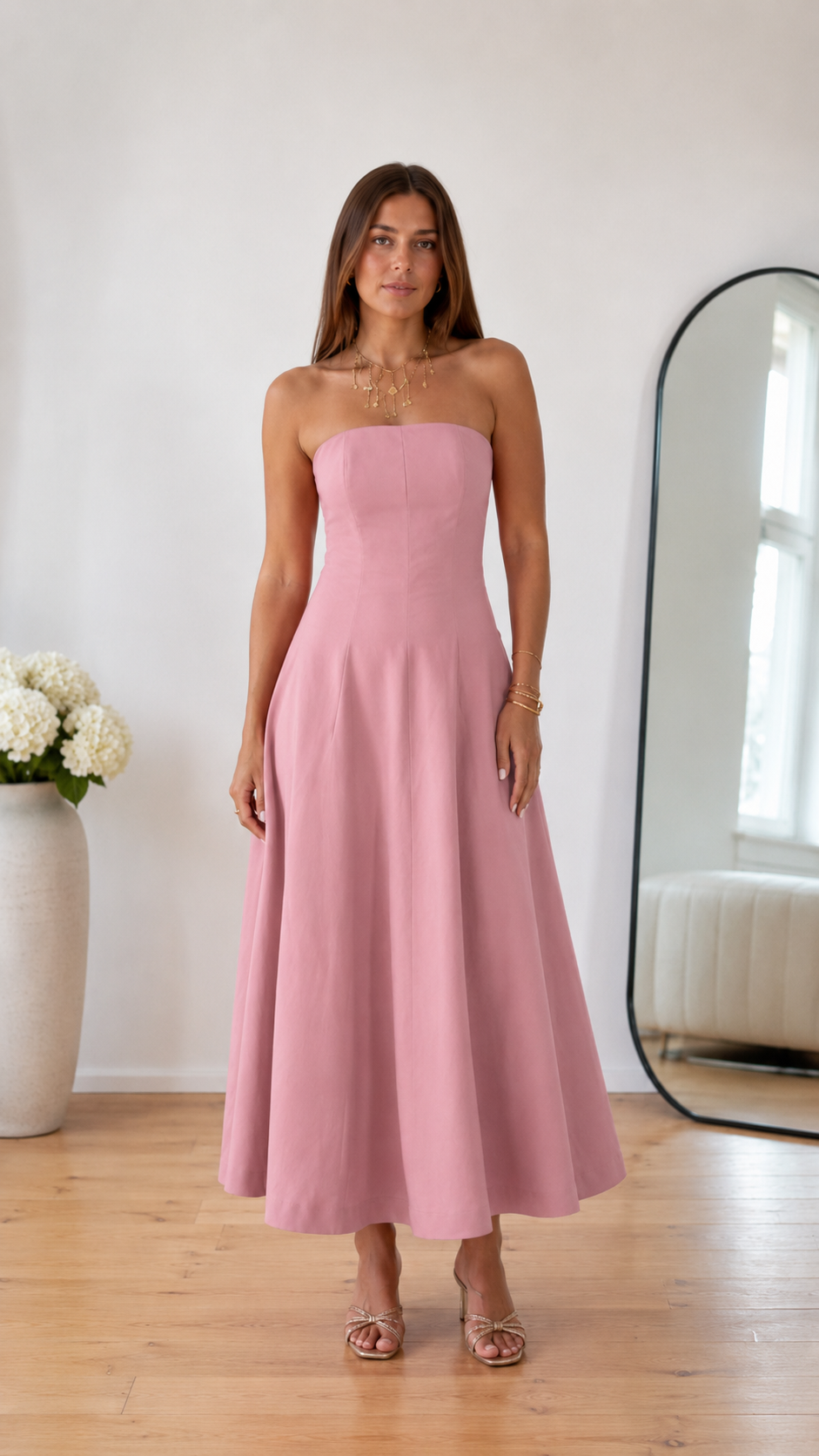 Front view of blush pink strapless midi dress