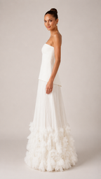 Side view of ivory strapless maxi gown showing slim bodice and flowing silhouette