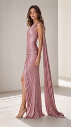 Side view of dusty rose fitted pleated evening gown with high slit and long shoulder panel