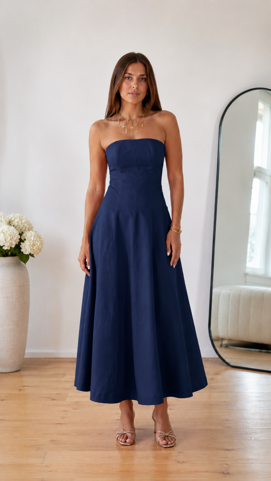 Front view of navy strapless A-line midi dress